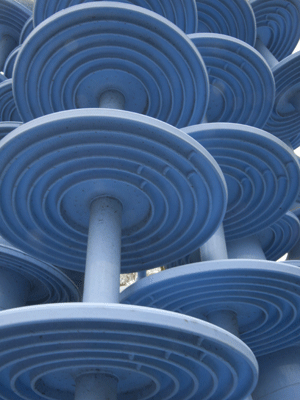 stack of blue electrical insulators