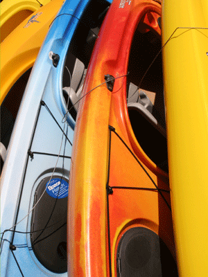 line of bright kayaks